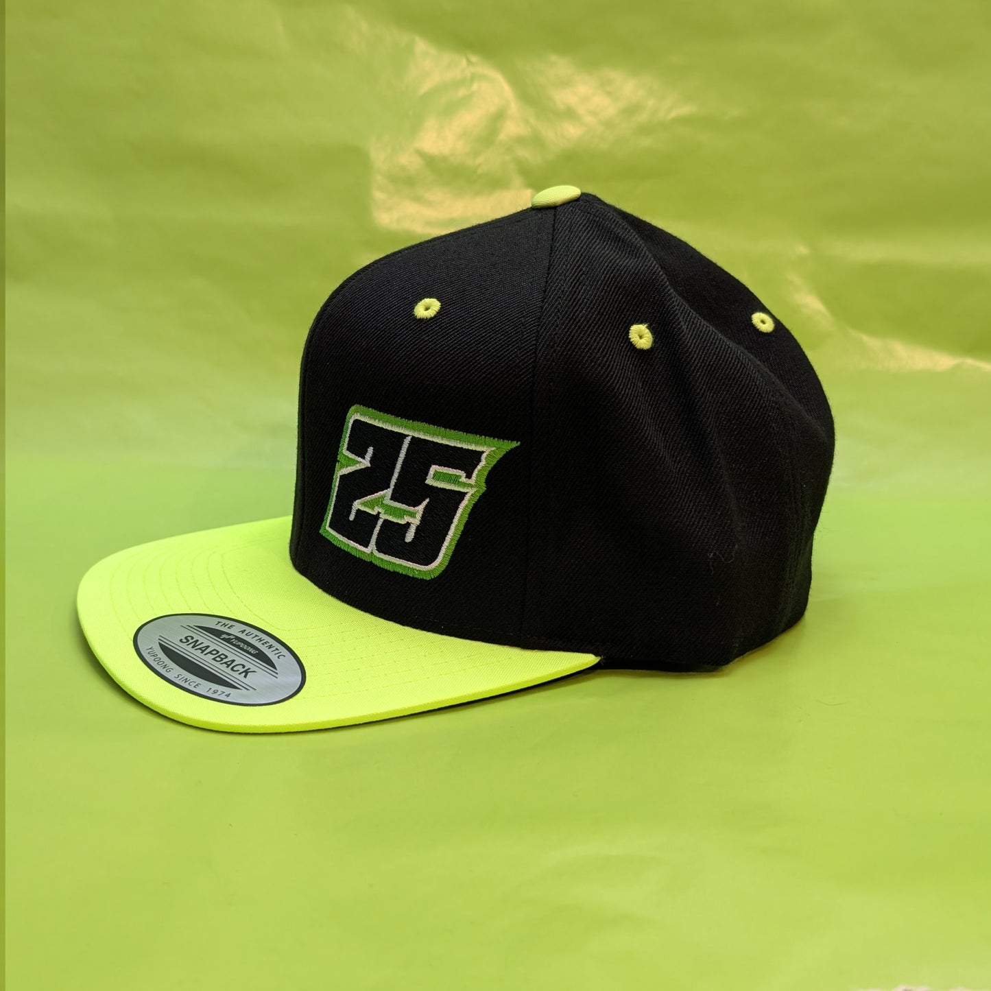 25 Flatbill Snapback with Silver Flag on Back